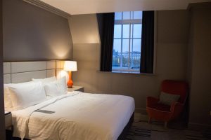 A decent sized room with very tall windows!